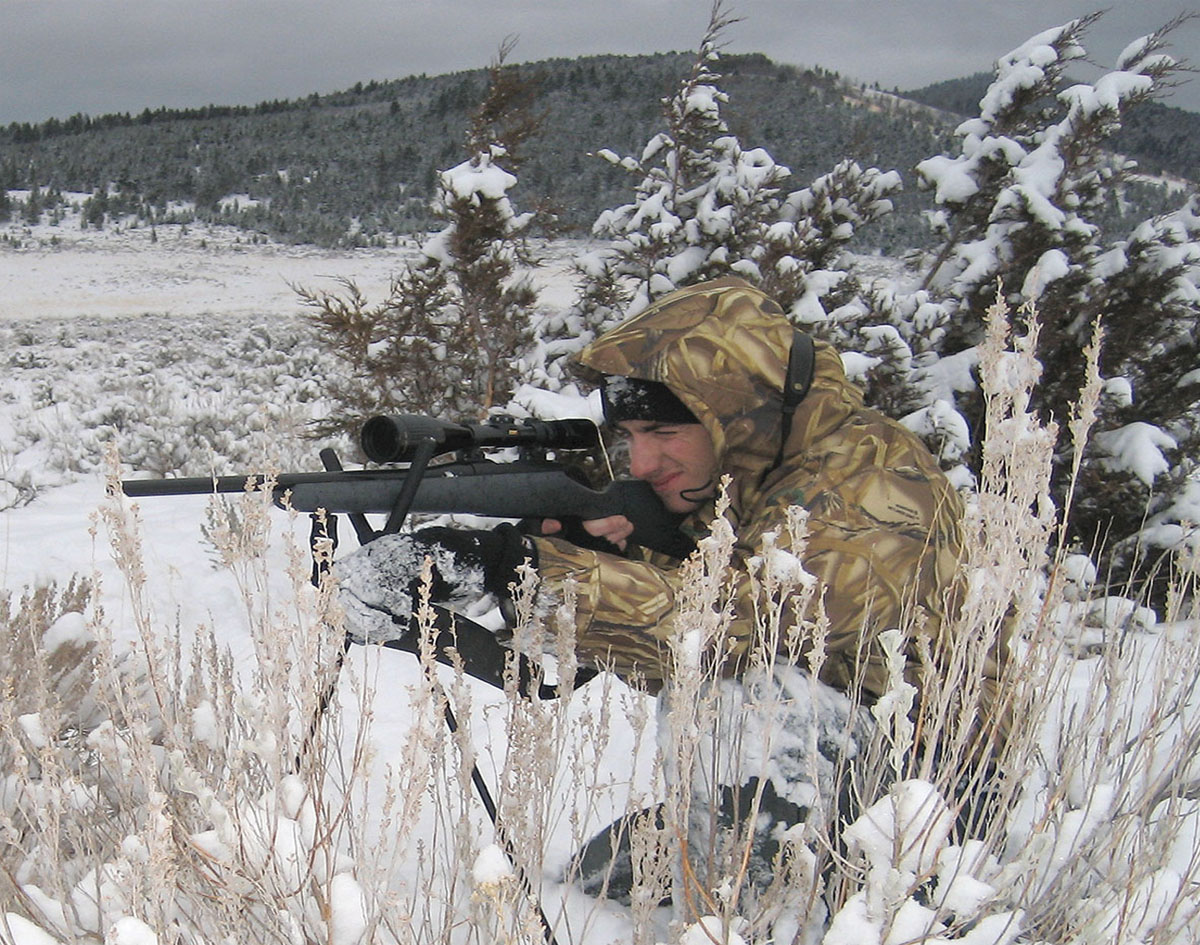 A variable power scope is best for a coyote rifle. This hunter has a Nikon 4-12x on his .223 Remington.